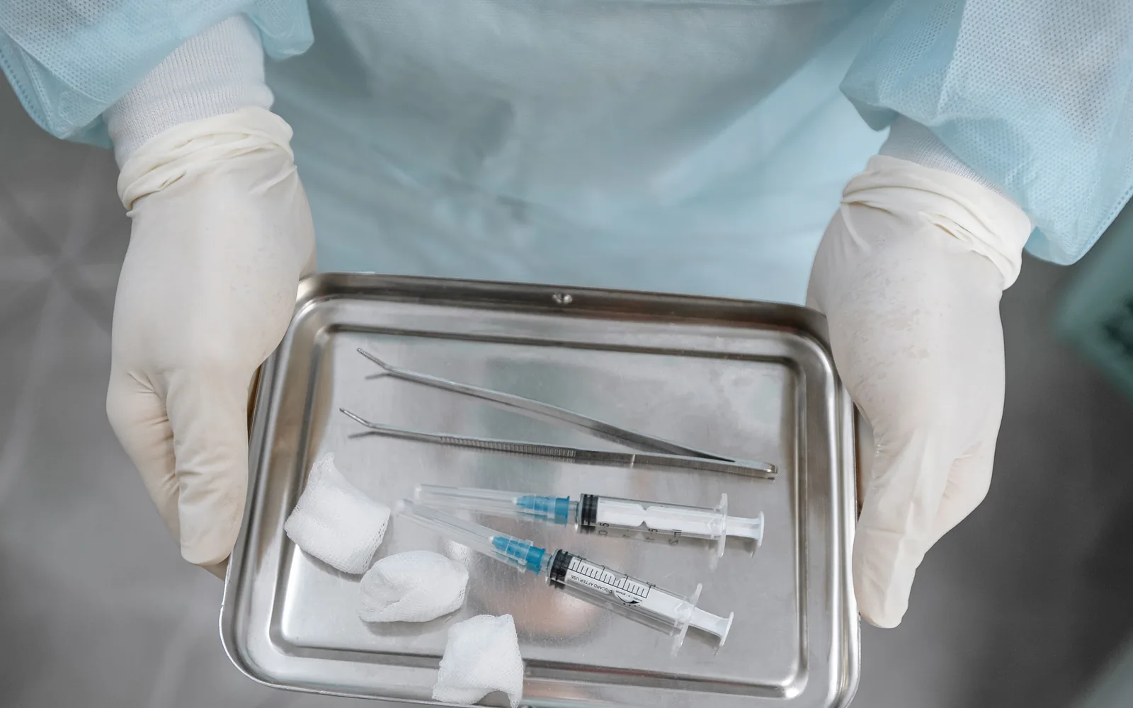 Sterile tray of syringes and instruments prepared for an image-guided injection